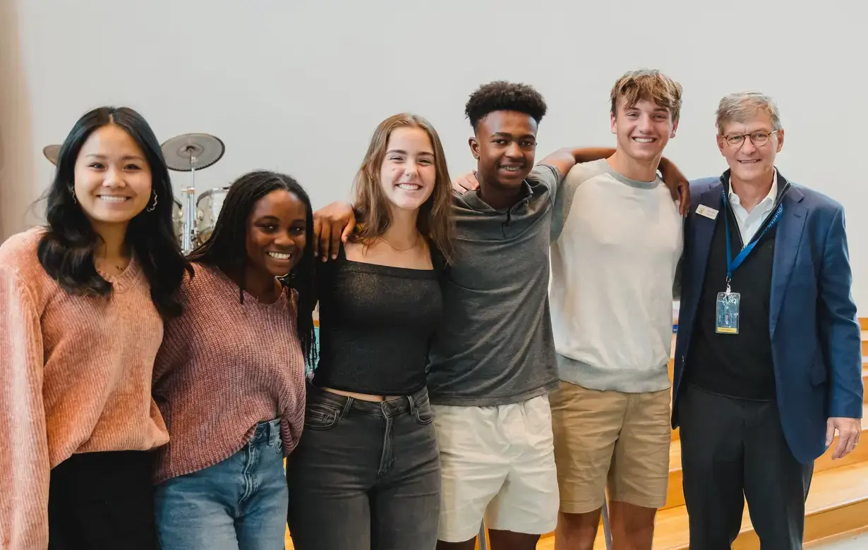 Group of Trinity students smiling at camera