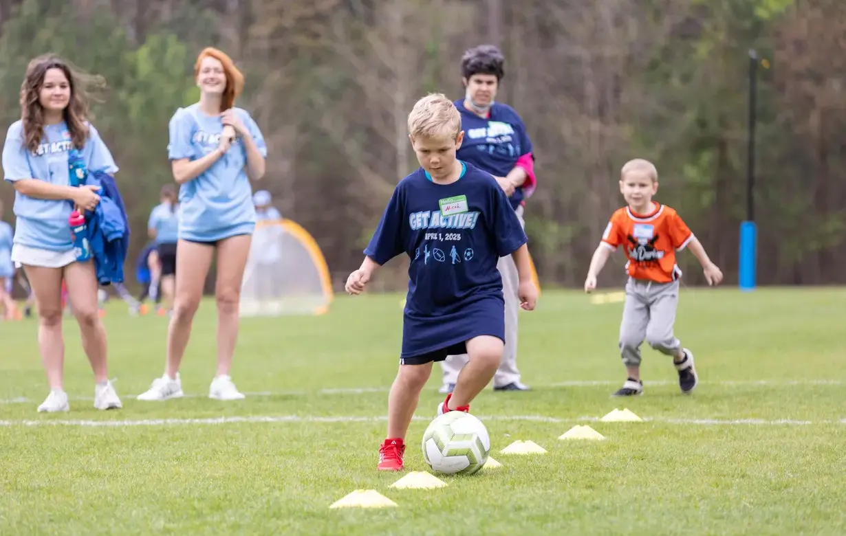 Trinity Lower School student playing football