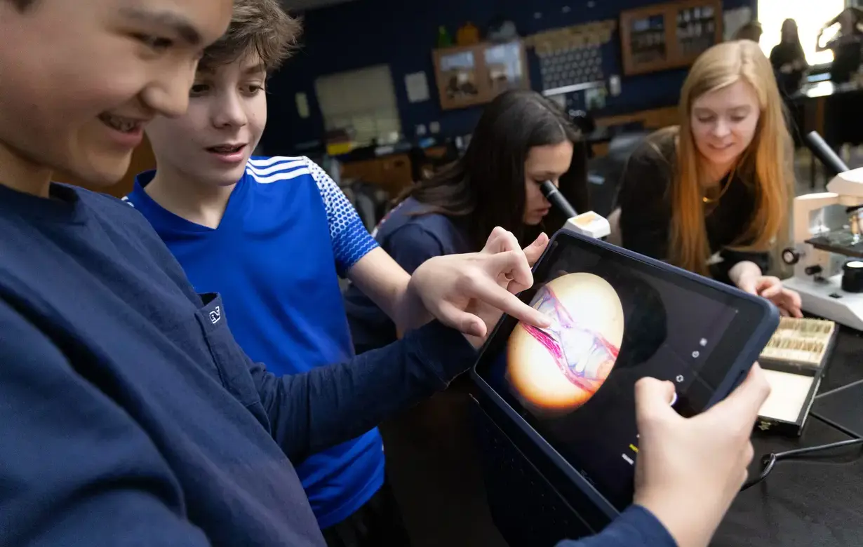 Two middle school students looking at iPad