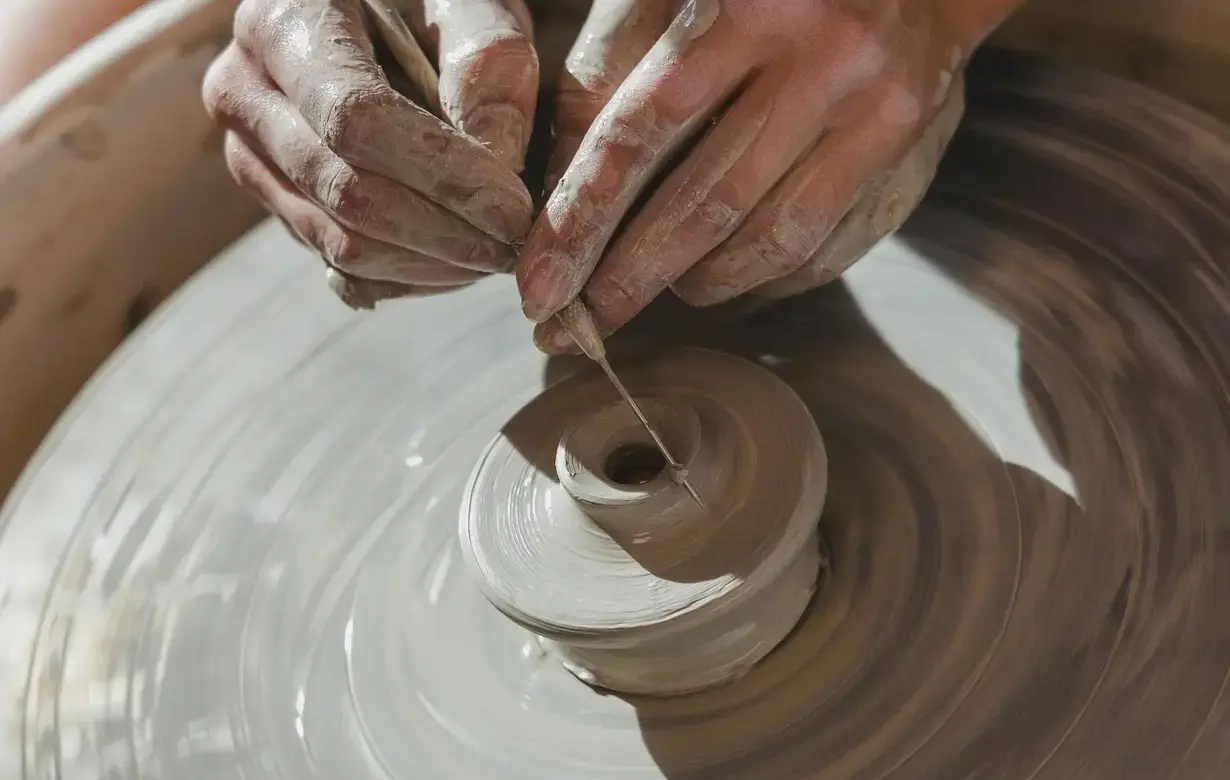 Student making clay pot