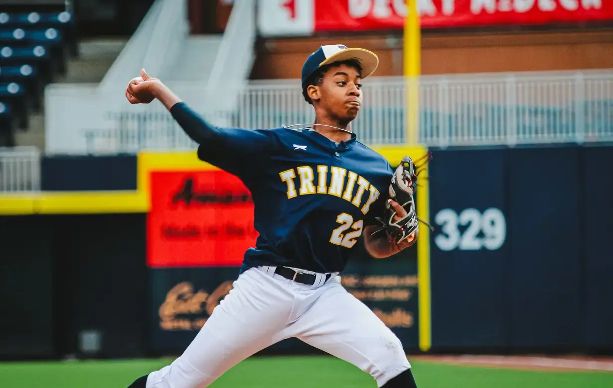 Male student playing baseball