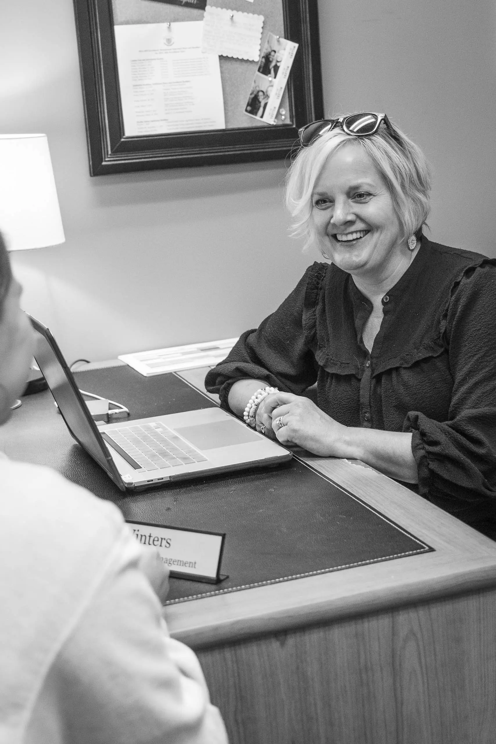 Friendly Enrollment Manager Meeting with Student - Black and White Office Portrait